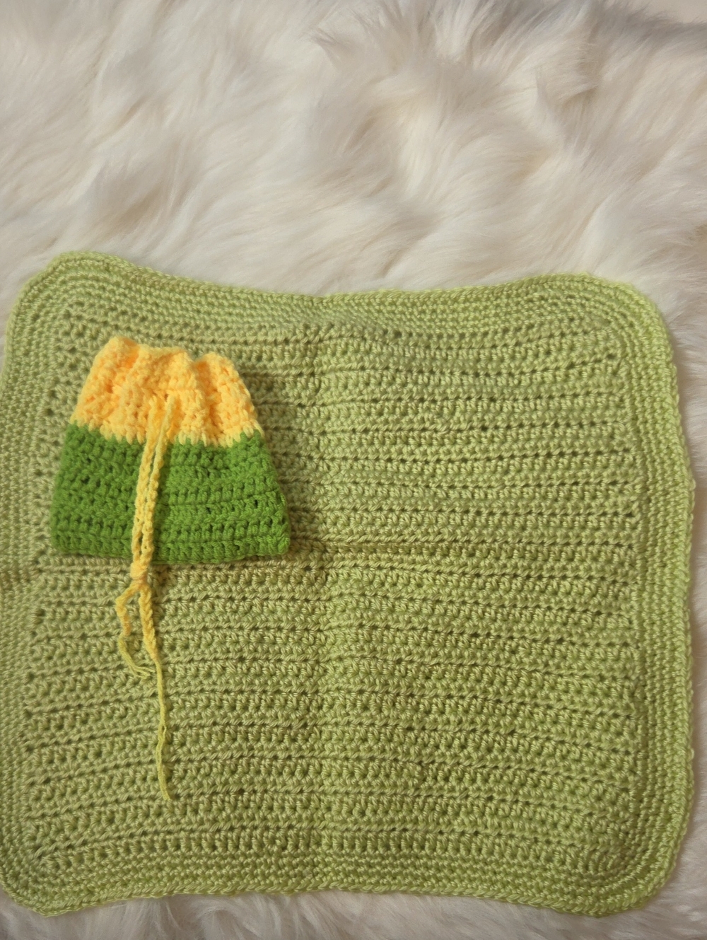 Handmade Light Green Crochet Mini Baby Doll Blanket with Yellow-Green Purse.